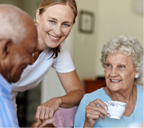 staff serving seniors tea