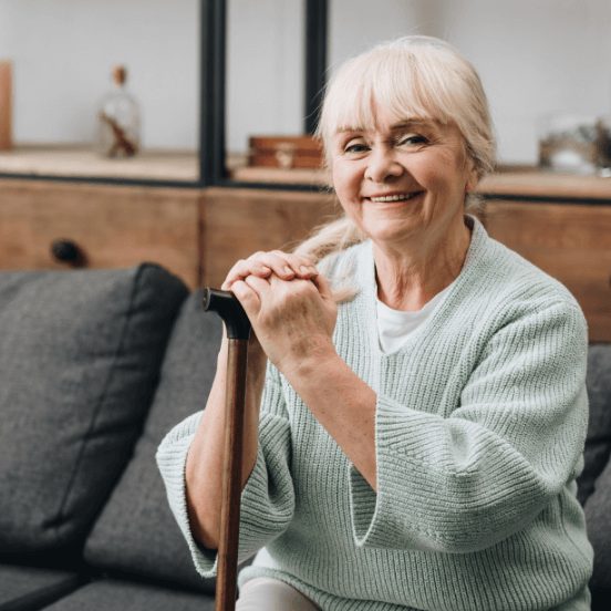 Senior woman smiling with cane